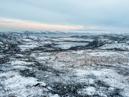 Slippery Arctic road through the hills. Winter Teriberka.の写真素材