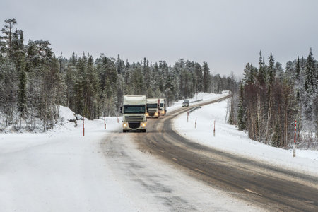 Russia, Teriberka, November, 30 2020. The car is parked on a hill in the arctic tundra. Travel concept of traveling by car. Slippery Arctic road through the hills. Winter Teriberka.のeditorial素材