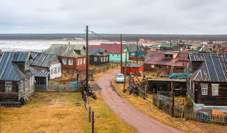 A wooden chapel built for the filming of the film. Snowy winter landscape with authentic cinematic house on the shore in the Russian village Rabocheostrovsk.のeditorial素材