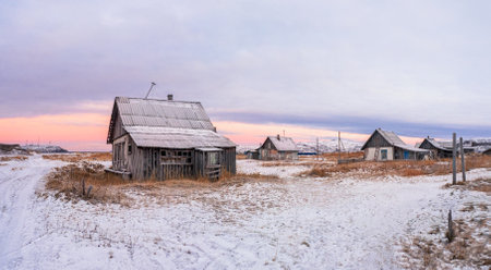 A wooden chapel built for the filming of the film. Snowy winter landscape with authentic cinematic house on the shore in the Russian village Rabocheostrovsk.のeditorial素材