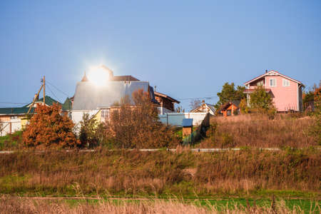 Cottage village. Autumn view of a modern cottage village on autumn hill. Russia.の写真素材