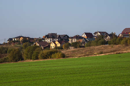 Panoramic view of green grass on slope with blue sky.の写真素材