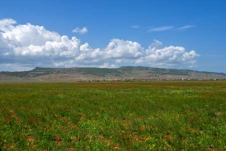 Panoramic view of the red mountain cut by canyons. Rock formation in Dagestan.
