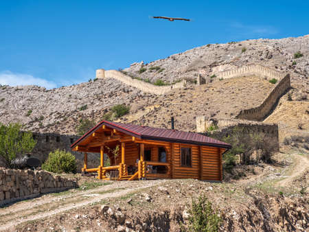Russia. Dagestan. Gunib. May 2021. Tourist wooden cottage at the foot of the Gunib fortress. New...