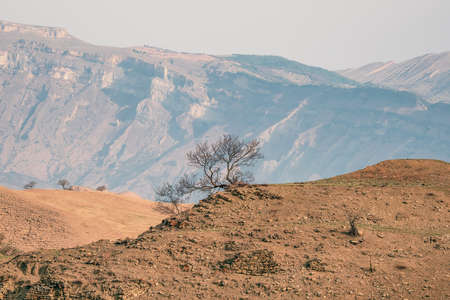 Blue mountain lake in the caldera. Mountain range against a blue cloudy sky. Caldera of an extinct...