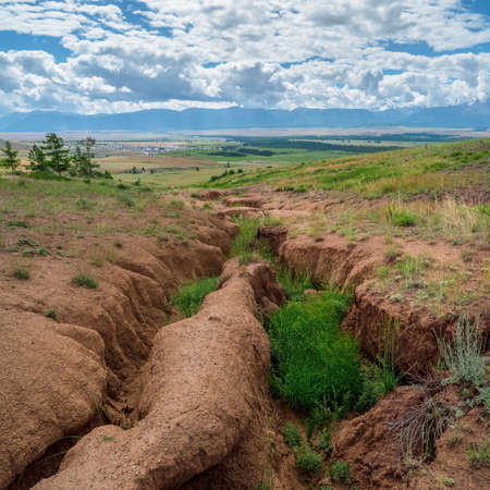 Soil erosion, deep ravine in the distance. Square view.の写真素材