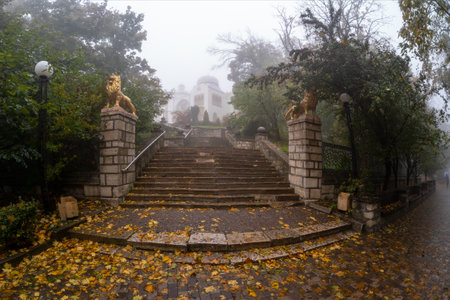 Zheleznovodsk, Russia - October, 2022: Soft focus. The palace of the Emir of Bukhara in a foggy morning park. Beautiful urban wet and foggy architecture. Foggy rainy autumn landscape.のeditorial素材