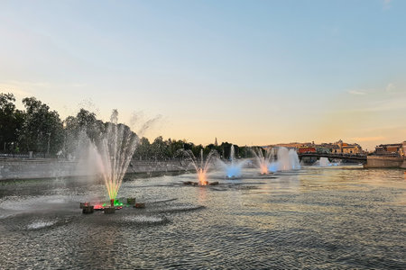 Tretyakov Pier. View of Moscow by evening. Colored water fountain. Many fountains on river.の写真素材