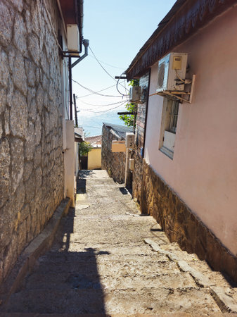 Gurzuf, the old street of the city. Walking through the streets of Gurzuf. Real southem city life. Street and views of the seaside city Gurzuf. Beautiful autumn day.の写真素材