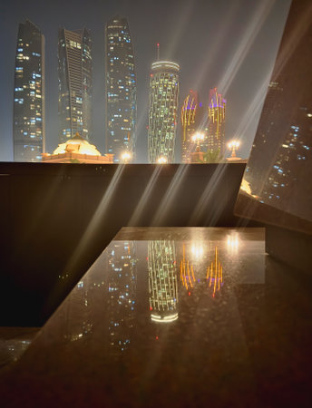 Abstract vertical background with skyscrapers and geometric reflections. Night Dubai.