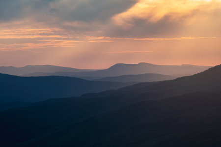 Sunset in the Crimean mountains. Vivid panoramic sunset or sunrise scenery in mountain valley in illuminating color.の写真素材