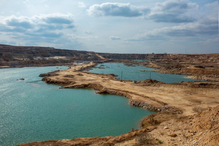 Old quarry flooded with water. Gypsum quarry with flooded mines.