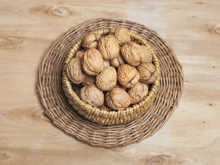 Walnuts in a wicker bowl. Top view, copy space.の写真素材