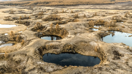 Craters filled with water, aerial view. Hole surface and clear water inside pattern in nature rock background in Altai.の写真素材