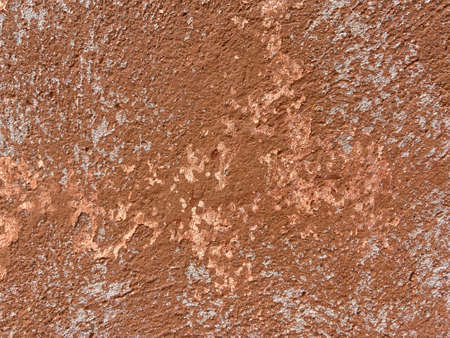 Dark Red Plastered Wall With Dirty Red Brown Scratched Horizontal Background. Aged weathered red street wall background. Retro Vintage Messy And Cracked Rusty Wallpaper.の写真素材