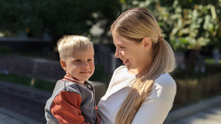 happy mother with a baby boy in her arms