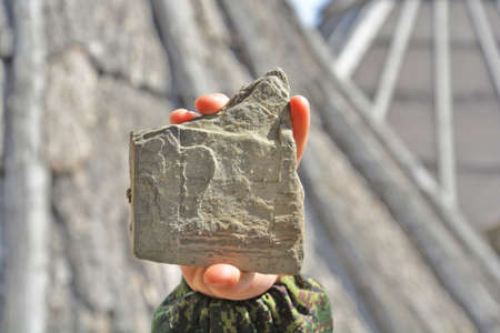stone in a childs hand
