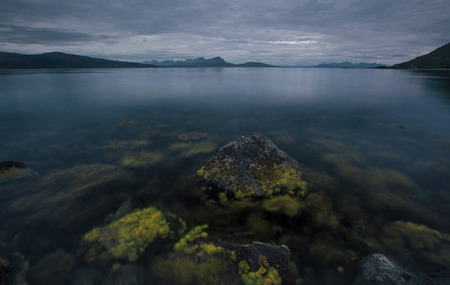 Sea shore on the Lofoten islands, Norway with view to sea and mountains at summer timeの写真素材