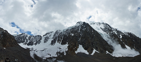 Beautifull valley with view to snow mountains and avalanche  in Altaj, Russia  at the summerの写真素材