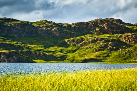 Beautifull valley with view to snow mountains and  clear lake as mirror in Altaj, Russia  at the summerの写真素材