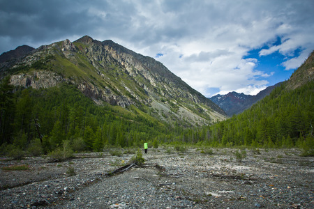 Beautifull  valley with view to mountains, forest and hiker in Altaj, Russia  at the summerの写真素材
