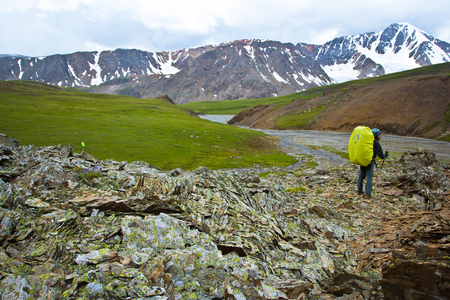Climber in the snow mountains on the trail in Altaj, Russia  at the summerの写真素材