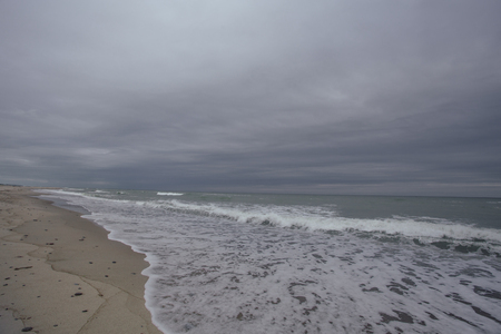 Storm on the see with  waves on the sand beach in Curonian spitの写真素材