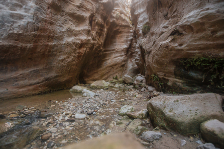 Misterious canyon Avakas with little stream and stones in the Cypros with sunlightsの写真素材