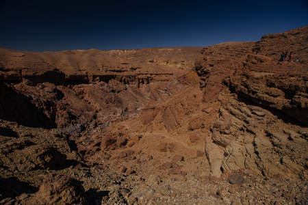 Mysterious Red canyon in the Israel with green plants and stonesの写真素材
