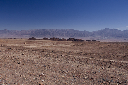 Way in the desert  in the Israil in sunny day with red mountains and blue sky near Eilatの写真素材