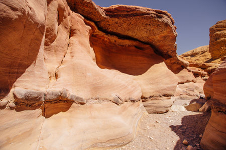 Way in the desert  in the Israil in sunny day with red mountains, green trees and blue sky near Eilatの写真素材