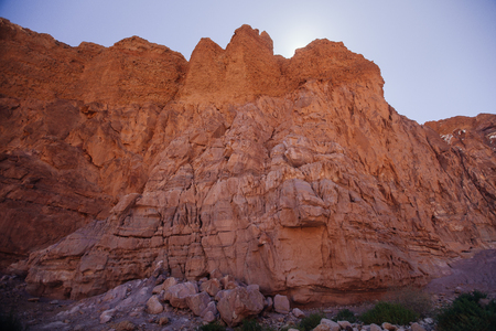 Way in the desert  in the Israil in sunny day with red mountains, green trees and blue sky near Eilatの写真素材