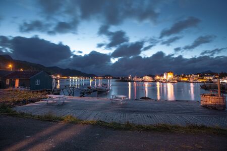 Robbu and font with view to city  and sea in the Norway at summer at sunsetの写真素材