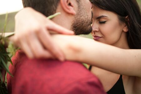 Young couple is hugging. Closeup.