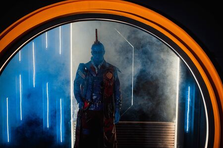 DNIPRO, UKRAINE - JUNE 26, 2019: Cosplayer portraying Yondu Udonta from movie Guardians of the Galaxy by Marvel Comics on the smoke background.のeditorial素材