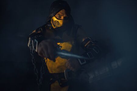 Dnipro, Ukraine - September 29, 2019: Cosplayer portraying Scorpion from the video game Mortal...
