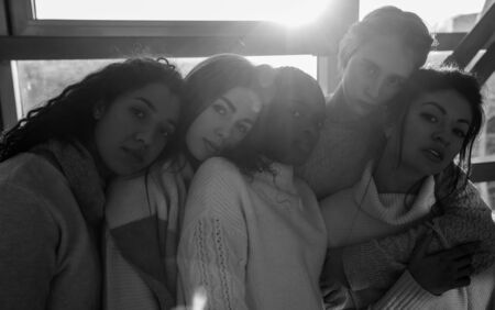 The portrait of multiracial group from five women. The concept of friendship and unity between different human races. Black and white image.の写真素材