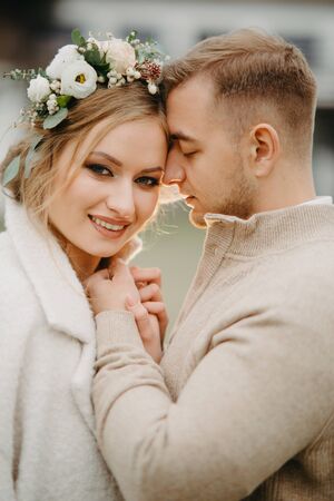 Newlyweds stand and embrace. Closeup.の写真素材