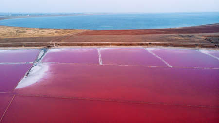 View from drone above the pink salty Genichesk lake and sand spit in Ukraine.の写真素材