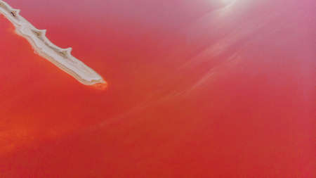 View from drone above the pink salty Genichesk lake and sand spit in Ukraine.の写真素材