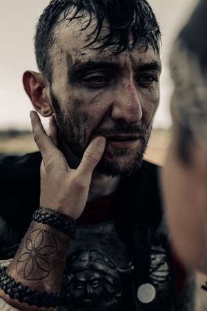 Ancient Spartan warrior says goodbye with his beloved woman before war and long parting. Closeup.の写真素材