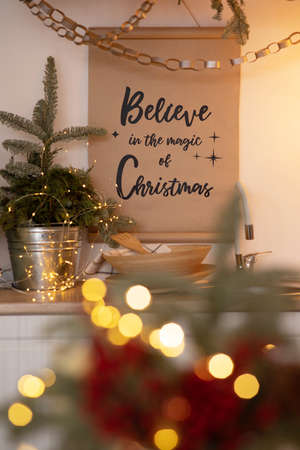 Christmas decoration and positive inscription on the kitchen wall. Closeup.の写真素材