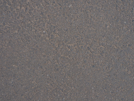Close-up and top view to rubberized gray running track on stadium with textured surface. Athletics, grip, non-slip surface. Textures and backgrounds for sport, fitness and training concepts.の写真素材