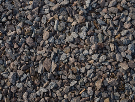 Close-up top view of detailed texture gravel and crushed stones, natural patterns backgrounds, rough surface. Building material for construction, landscaping.の写真素材