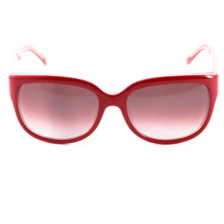 Sun goggles and glasses for vision in red frames Red glasses frames on white backgroundの写真素材