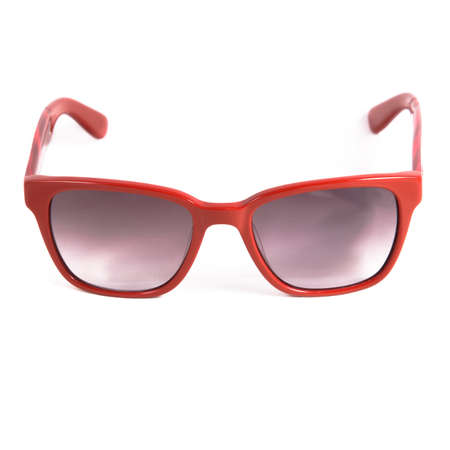 Red glasses frames on white background. Sun goggles and glasses for vision in red frames.の写真素材