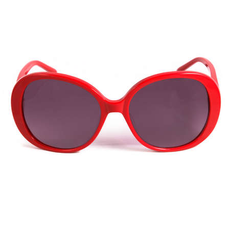 Red glasses frames on white background. Sun goggles and glasses for vision in red frames.の写真素材