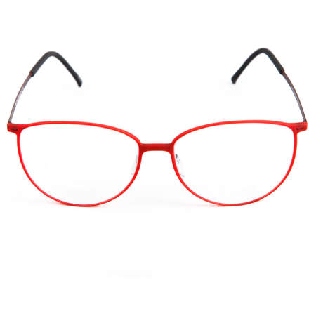 Red glasses frames on white background. Sun goggles and glasses for vision in red frames.の写真素材