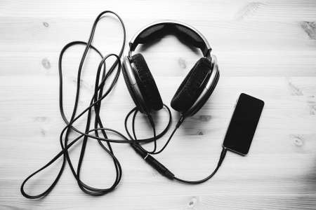 headphones with cellphone on the desk