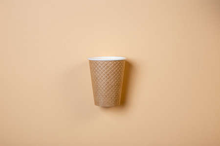 textured paper cup on a cream background